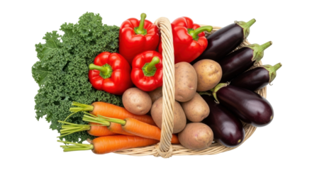 Isolated wicker basket of fresh vegetables including kale, red bell peppers, eggplants and carrots