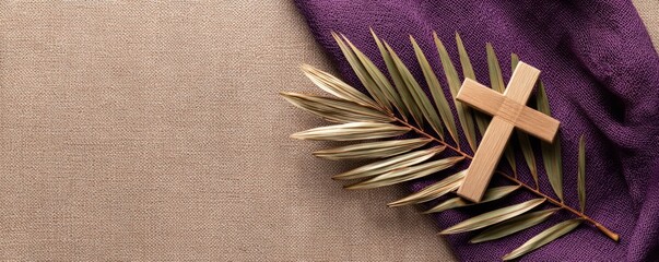 Purple fabric drapes over light beige stone surface. Palm leaves, wooden cross laid on top. Image suggests Lent season concept. Symbolic representation of Holy Week, Good Friday. Beautiful, religious
