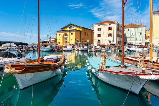 Small pleasure and fishing boats in the harbour of the holiday town of Piran, Slovenia.