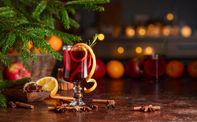 Christmas mulled wine with citrus, apples, cinnamon, anise, and rosemary.
