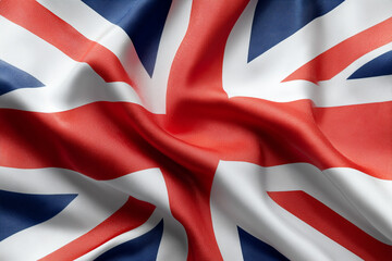 Fototapeta premium Waving flag of United Kingdom in white background. United Kingdom flag for independence day. The symbol of the state on wavy fabric.