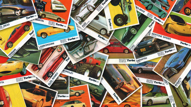 Collection of vintage paper inserts Turbo bubble gum, scattered in disarray. Collectible wrappers. Automobiles and super cars. Editorial material. Background or wallpaper. 15 november 2025 Ulaanbaatar