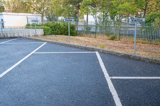Parking space marking sign for visitors inside the RTP facilities in Lisbon. Parking space marking sign for administration and another for visitors inside the RTP facilities in Lisbon.
