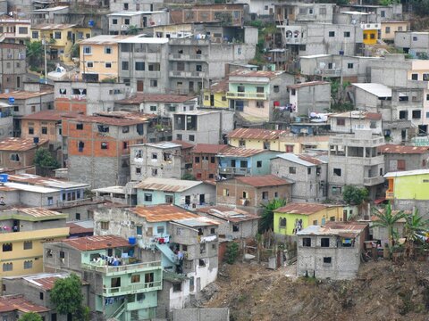 Densely built hillside homes in Guayaquil, Ecuador, showing colorful urban architecture and informal residential development.