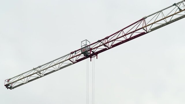 Tower Crane Boom Moving from Right to Left with Cable Hook Appearing 