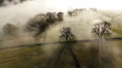 Scenic Cloud Inversion at the Peak District National park in the UK.  Cinematic Drone Landscape Exploration around Froggatt Edge, Curbar Edge and Baslow Edge, which are the most popular hiking trails.
