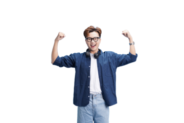 Joyful man celebrating: An enthusiastic man, full of youthful energy, celebrates with raised arms, smiling broadly with headphones around his neck, capturing his happiness. 