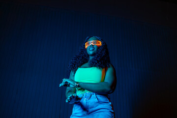 Woman wearing glowing glasses moving in a vibrant cyberpunk setting