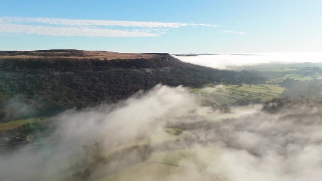 Scenic Cloud Inversion at the Peak District National park in the UK.  Cinematic Drone Landscape Exploration around Froggatt Edge, Curbar Edge and Baslow Edge, which are the most popular hiking trails.