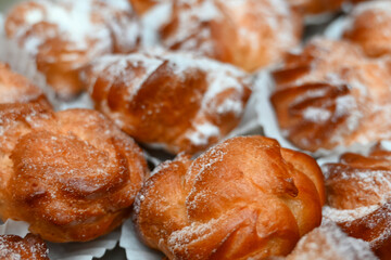tray of delicious sweet cream puffs at a business event