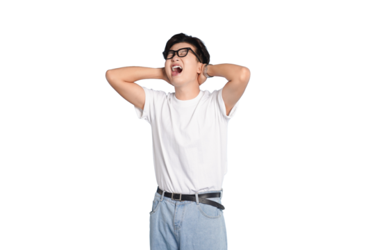 Expressing Frustration: A young man with eyeglasses, clad in casual attire, his hands covering his ears, visibly expressing feelings of annoyance or being overwhelmed. 