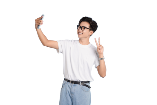 Selfie Time: A young man takes a selfie. With a cheerful smile and peace sign. Showing the modern approach to capturing life's moments.