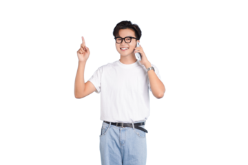 Youthful Expression: A young man exudes energy as he holds a mobile phone to his ear while pointing upwards, conveying an aura of innovation and excitement.