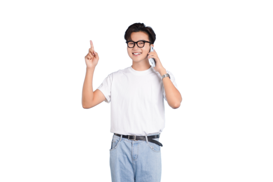Youthful Expression: A young man exudes energy as he holds a mobile phone to his ear while pointing upwards, conveying an aura of innovation and excitement.