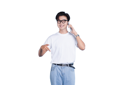 Friendly Conversation: A young individual smiles warmly as they engage in a phone conversation, pointing down while communicating a thoughtful and positive message.