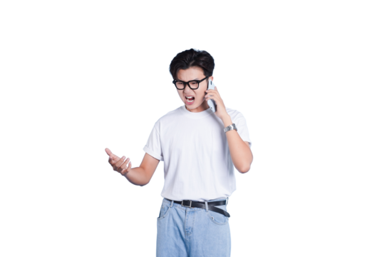 Frustrated Phone Call: A young man is captured in a moment of frustration, his expression a mix of annoyance as he holds a phone to his ear.