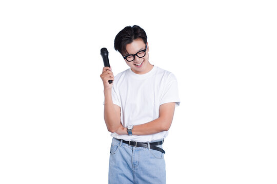 Microphone and Grinning: A bespectacled individual, embraces the limelight, holding a microphone. This image captures the essence of vocal performance and public speaking.