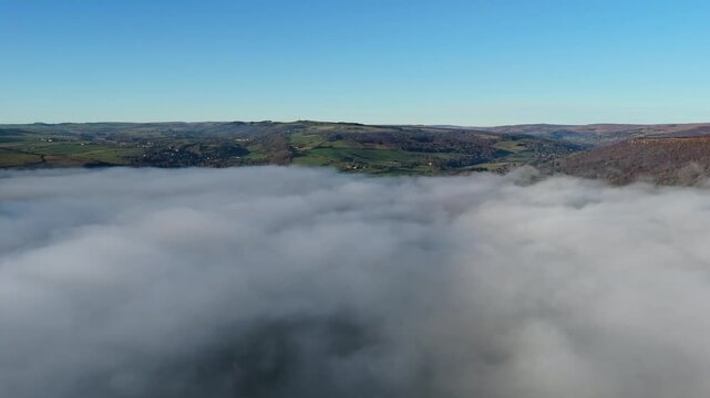 Scenic Cloud Inversion at the Peak District National park in the UK.  Cinematic Drone Landscape Exploration around Froggatt Edge, Curbar Edge and Baslow Edge, which are the most popular hiking trails.