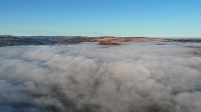 Scenic Cloud Inversion at the Peak District National park in the UK.  Cinematic Drone Landscape Exploration around Froggatt Edge, Curbar Edge and Baslow Edge, which are the most popular hiking trails.