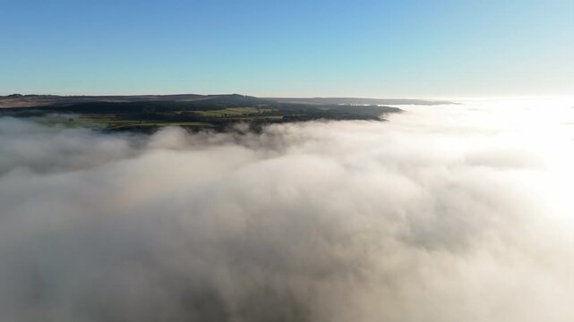 Scenic Cloud Inversion at the Peak District National park in the UK.  Cinematic Drone Landscape Exploration around Froggatt Edge, Curbar Edge and Baslow Edge, which are the most popular hiking trails.