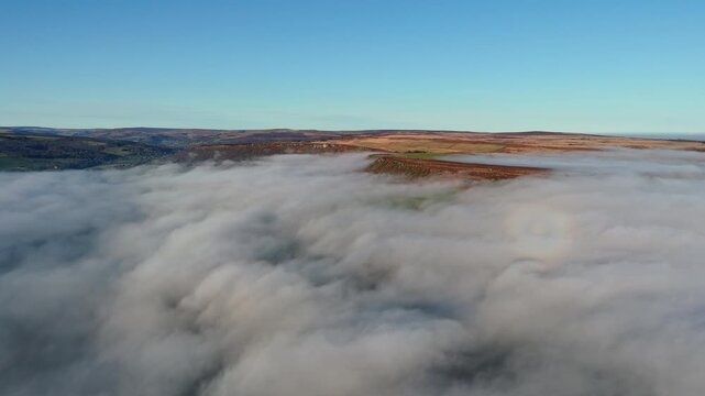 Scenic Cloud Inversion at the Peak District National park in the UK.  Cinematic Drone Landscape Exploration around Froggatt Edge, Curbar Edge and Baslow Edge, which are the most popular hiking trails.