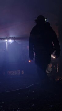 Rescue forces search for survivors inside a dark tunnel using flashlights