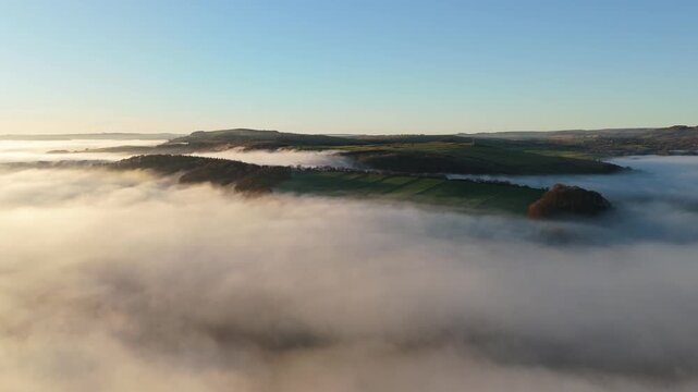 Scenic Cloud Inversion at the Peak District National park in the UK.  Cinematic Drone Landscape Exploration around Froggatt Edge, Curbar Edge and Baslow Edge, which are the most popular hiking trails.
