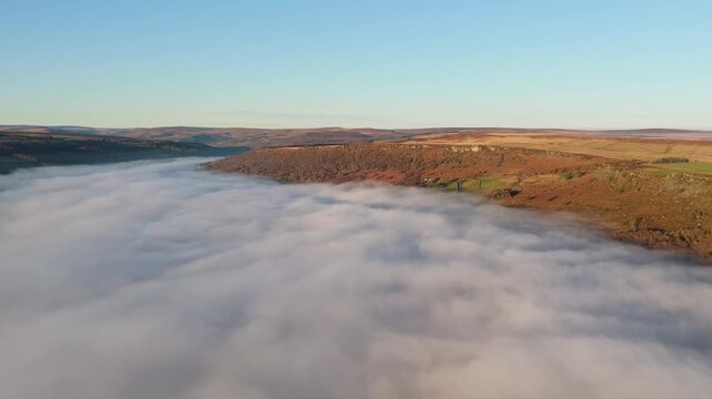Scenic Cloud Inversion at the Peak District National park in the UK.  Cinematic Drone Landscape Exploration around Froggatt Edge, Curbar Edge and Baslow Edge, which are the most popular hiking trails.