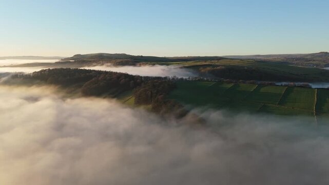 Scenic Cloud Inversion at the Peak District National park in the UK.  Cinematic Drone Landscape Exploration around Froggatt Edge, Curbar Edge and Baslow Edge, which are the most popular hiking trails.