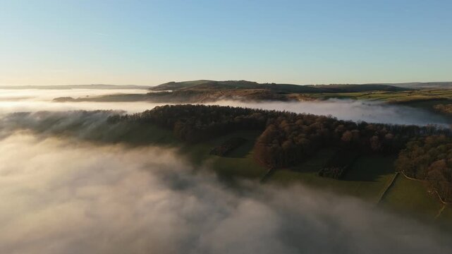 Scenic Cloud Inversion at the Peak District National park in the UK.  Cinematic Drone Landscape Exploration around Froggatt Edge, Curbar Edge and Baslow Edge, which are the most popular hiking trails.