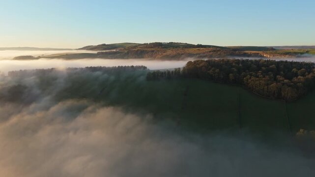Scenic Cloud Inversion at the Peak District National park in the UK.  Cinematic Drone Landscape Exploration around Froggatt Edge, Curbar Edge and Baslow Edge, which are the most popular hiking trails.