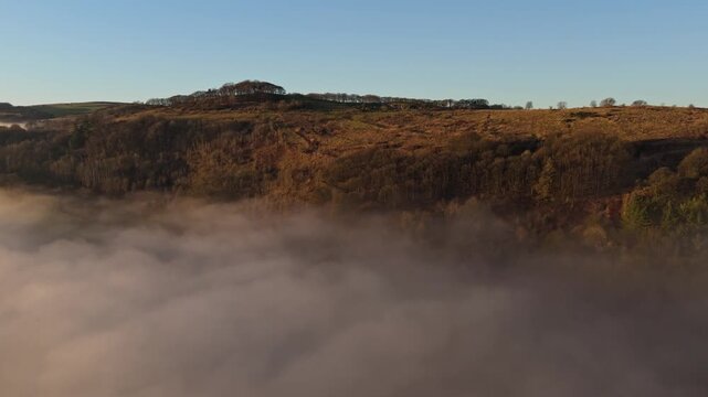 Scenic Cloud Inversion at the Peak District National park in the UK.  Cinematic Drone Landscape Exploration around Froggatt Edge, Curbar Edge and Baslow Edge, which are the most popular hiking trails.