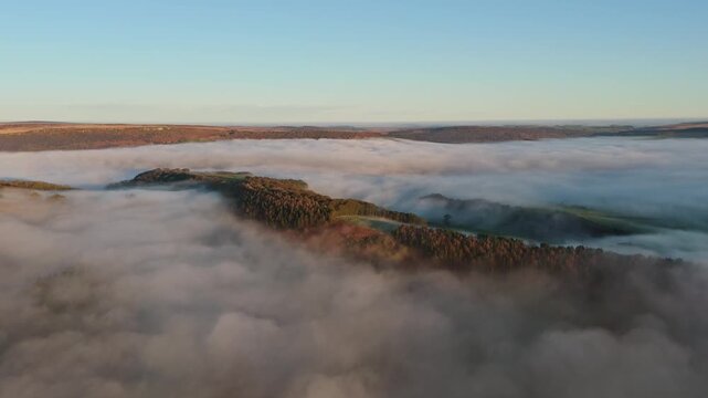 Scenic Cloud Inversion at the Peak District National park in the UK.  Cinematic Drone Landscape Exploration around Froggatt Edge, Curbar Edge and Baslow Edge, which are the most popular hiking trails.