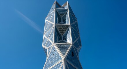 Looking up at the distinctive architecture of the cctv headquarters building in beijing, china, set against a clear blue sky on a sunny day