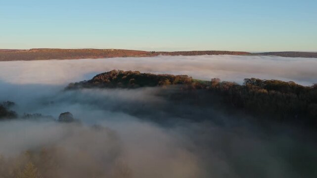 Scenic Cloud Inversion at the Peak District National park in the UK.  Cinematic Drone Landscape Exploration around Froggatt Edge, Curbar Edge and Baslow Edge, which are the most popular hiking trails.
