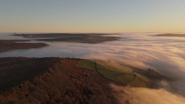 Scenic Cloud Inversion at the Peak District National park in the UK.  Cinematic Drone Landscape Exploration around Froggatt Edge, Curbar Edge and Baslow Edge, which are the most popular hiking trails.