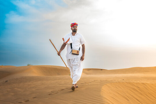 Man in desert Thar. A person in traditional attire in a desert of Rajasthan, India. 