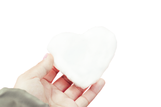 Hands holding a heart-shaped snowball, symbolizing love and warmth, with a transparent background for versatile design applications. transparent background, isolated image - Powered by Adobe