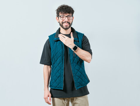 Young man making PLEASE gesture in sign language. Person gesturing PLEASE in nonverbal language