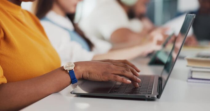 Laptop, hands and woman in classroom with typing for studying, education or assignment at university. Computer, research and female student learning for college test or exam in lecture at school.