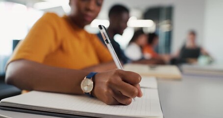Notebook, hands and woman in classroom for writing, studying or assignment at university. Education, pen and female student learning for college test or exam in lecture with scholarship at school.