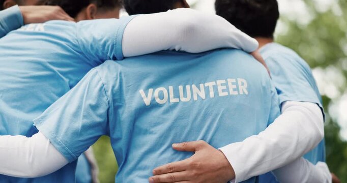 Volunteer, hug and people outdoor with huddle for NGO support, eco project or nonprofit service. Back, team or embrace in nature for social responsibility, climate change initiative and charity work.