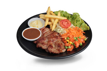 Pork steak with mixed vegetables on white background isolated