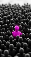 Obraz premium Mass of black human figures with one magenta individual standing out, symbolizing uniqueness, standing out, leadership, or individuality