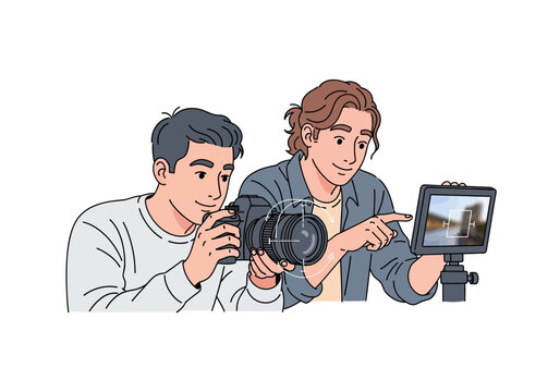 Two Photographers Reviewing Images on Camera and Monitor Screen