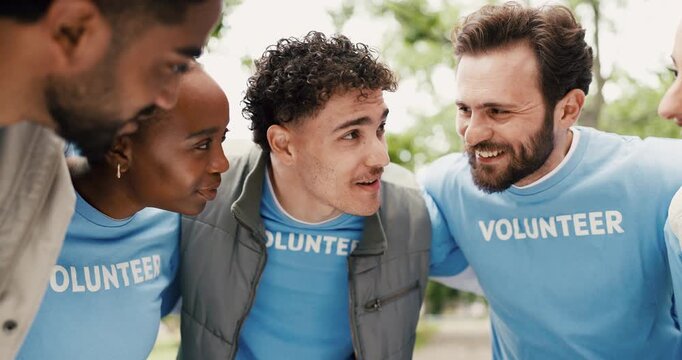 Volunteer, people and hug in park with talk for eco project, outreach program or nonprofit service. Team outdoor, huddle and discussion for charity work, climate change plan or social responsibility.