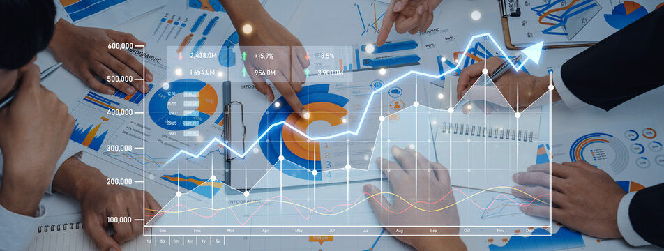 A business team collaborates during a meeting, analyzing financial graphs and charts with digital overlays. Demonstrates teamwork and strategic planning in an office environment. Scalp - Powered by Adobe