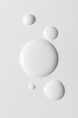 White cosmeticâ€™s product drops on white background