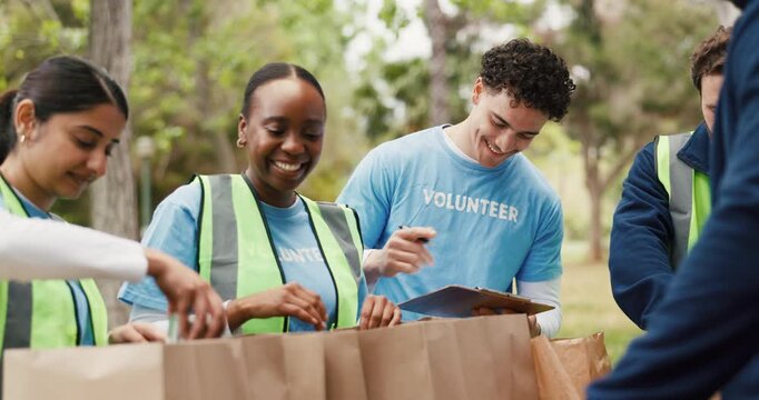 Food drive, high five and volunteer people in park together for charity, motivation or success. Groceries, smile and teamwork with excited friends outdoor in nature for activism or community service