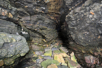 A natural view of the inside of a cave somewhere on the rocky cliff